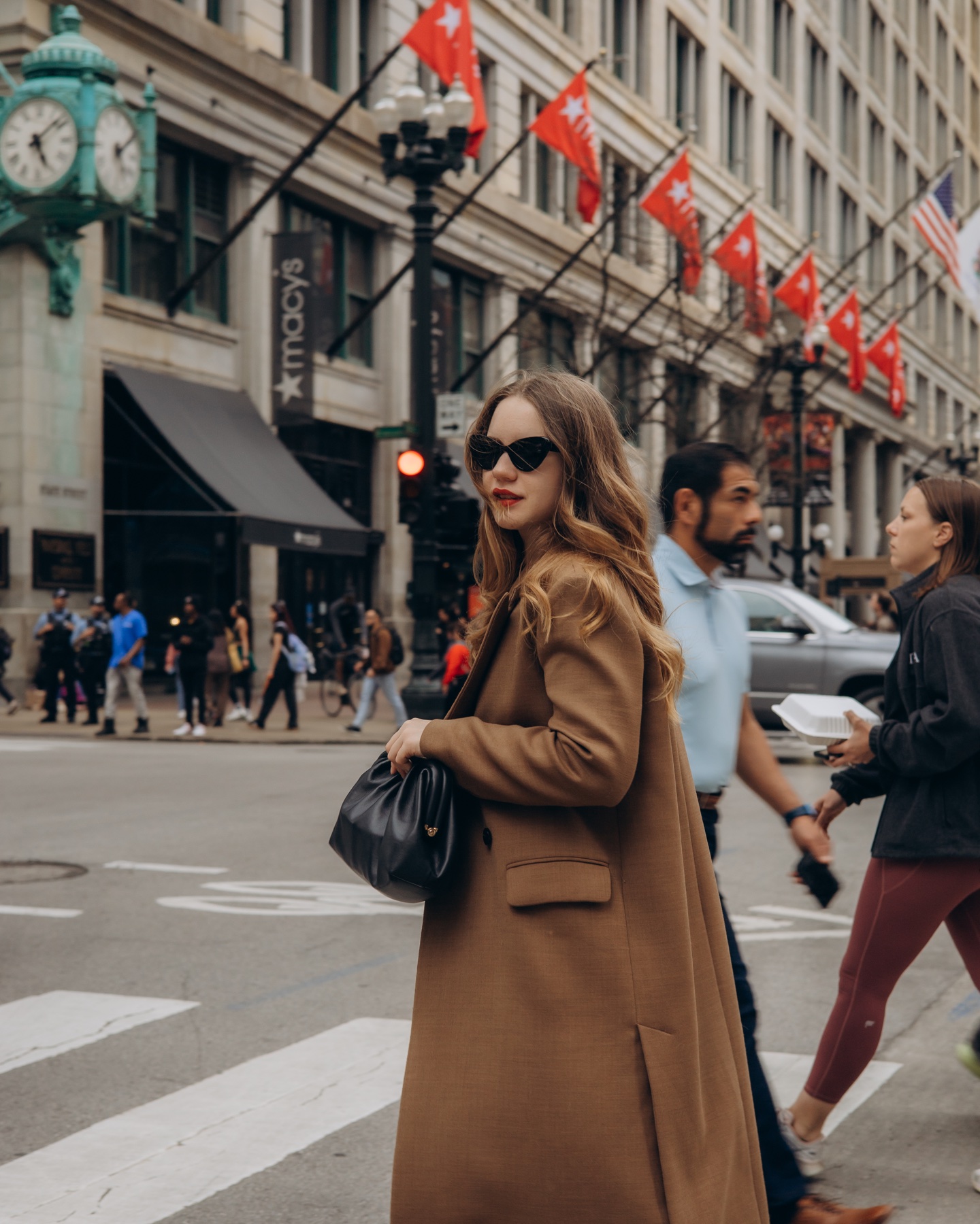 Anastasiia styling a black bag in the city