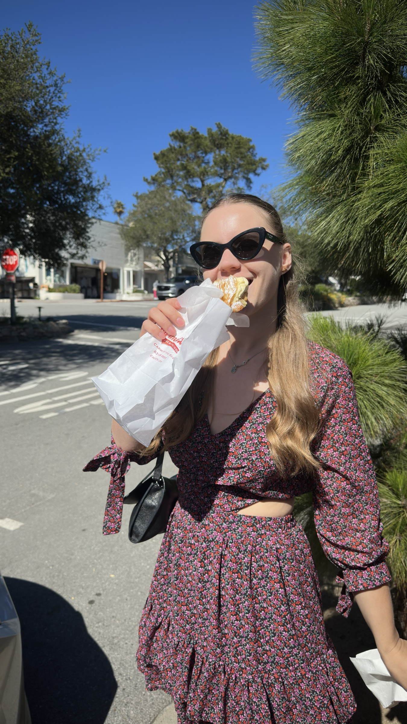 Anastasiia enjoying a pastry from a local bakery